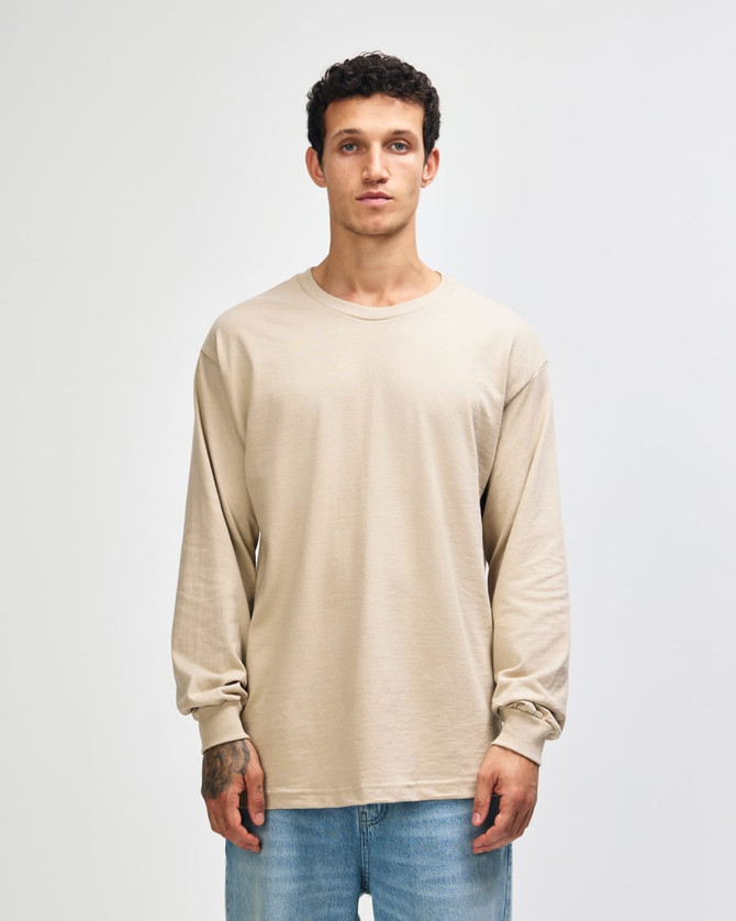 A lightweight cotton unisex long sleeve T-shirt in a neutral beige colour, featuring a logo.