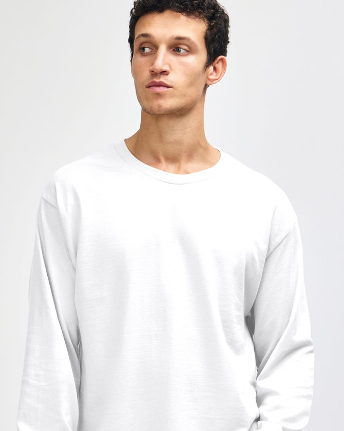 A heavyweight cotton unisex long sleeve T-shirt in white, featuring a minimalistic design and a logo.