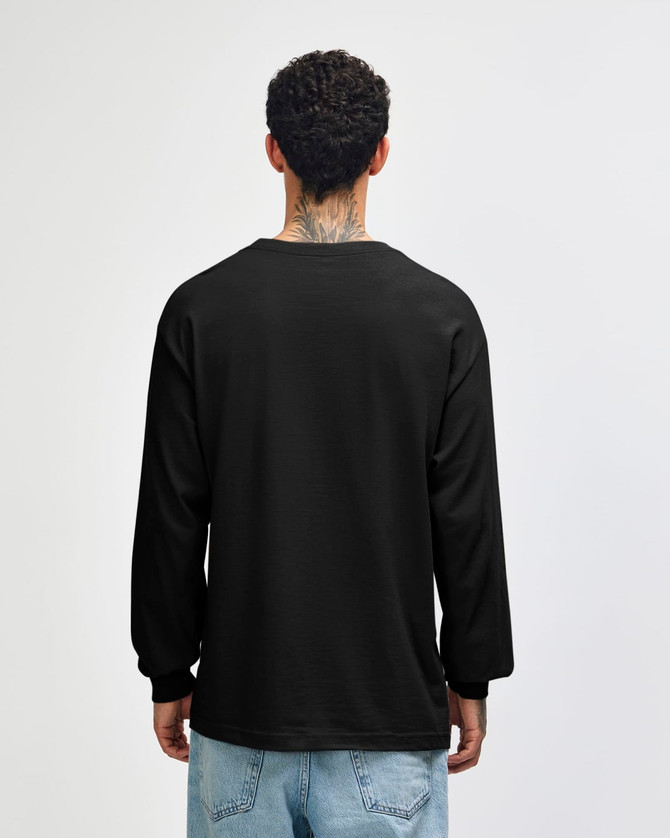 A black heavyweight cotton unisex long sleeve t-shirt viewed from the back, worn with olive green pants.