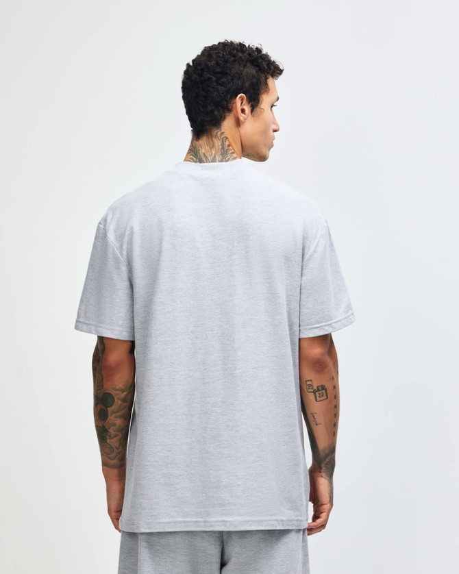 A grey unisex pique mockneck T-shirt displayed from the back. Features short sleeves and a logo.