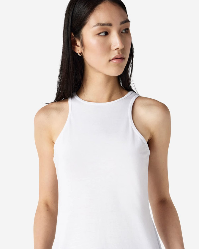 A white women's racerneck tank top featuring a form-fitting design and a logo.