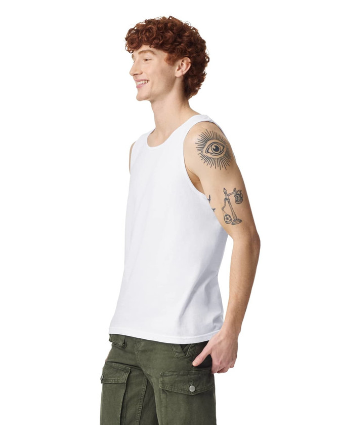 A white adult tank top displayed on a model with red curly hair and a tattoo on his arm.