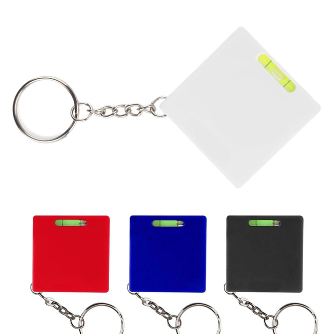 A set of four leveller tape measures in white, red, blue, and black, each attached to a keyring.