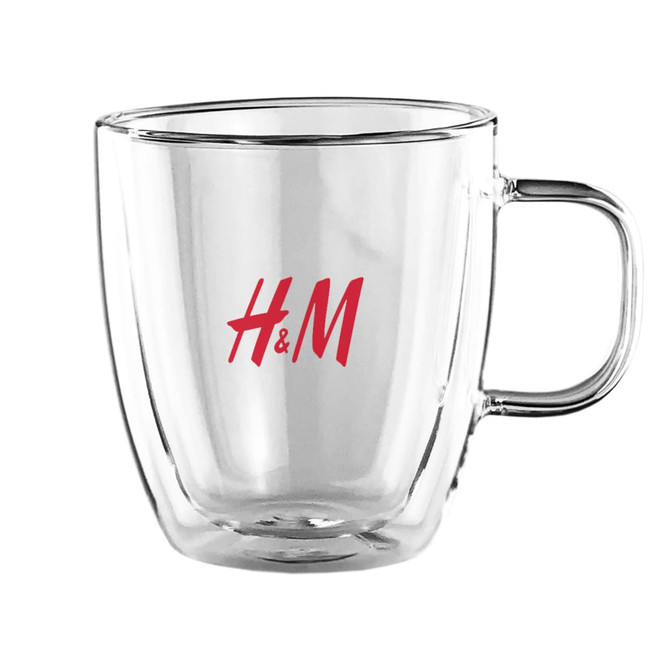 A drink cup made of transparent glass with a red logo, featuring a double wall design and comfortable handle.