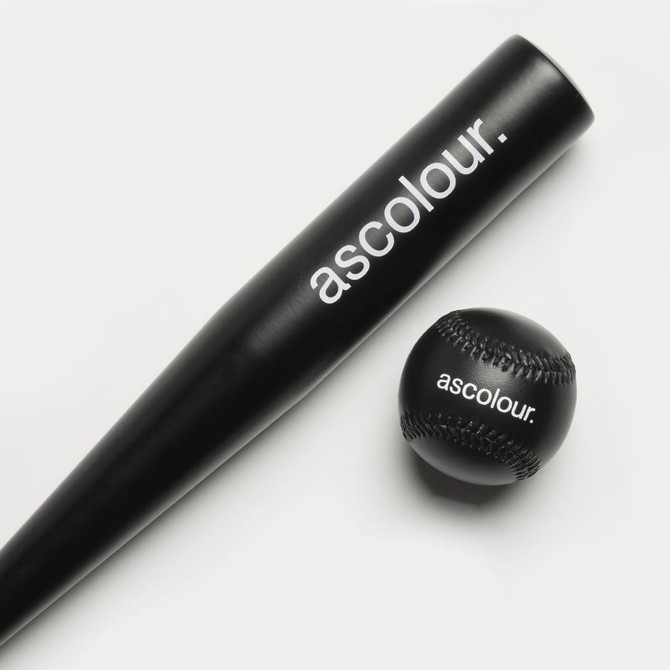 A black baseball bat and a matching baseball, both featuring a logo.