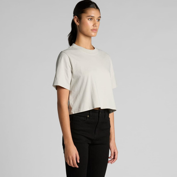 A cropped tee in a light grey colour, featuring short sleeves and a relaxed fit, displayed on a model.