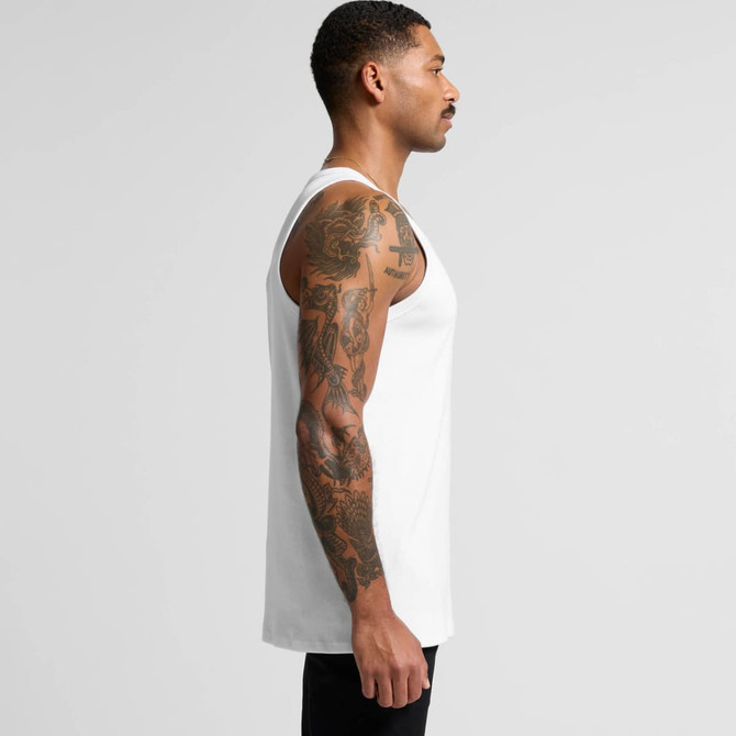 A side view of a man wearing a white organic rib singlet, showcasing his tattoos. The singlet has no visible branding.