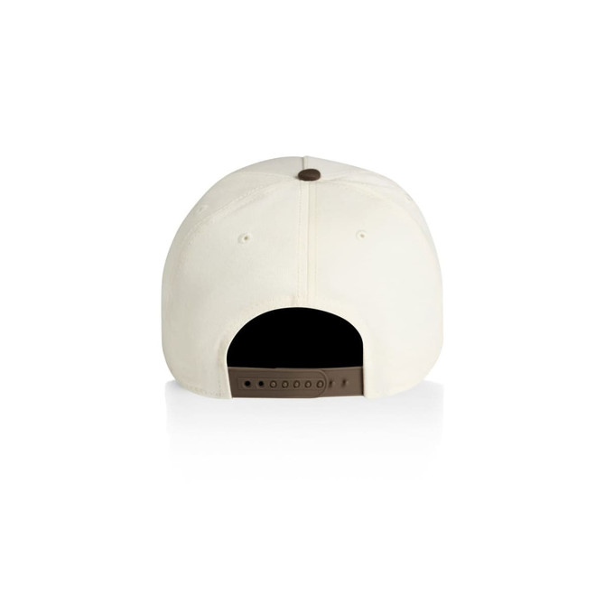 A two-tone cap in cream with a brown adjustable strap at the back and a button on top.