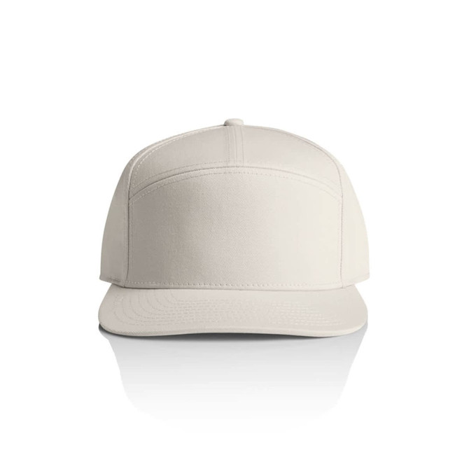 A beige 7-panel cap featuring a structured design and a front panel with a logo.