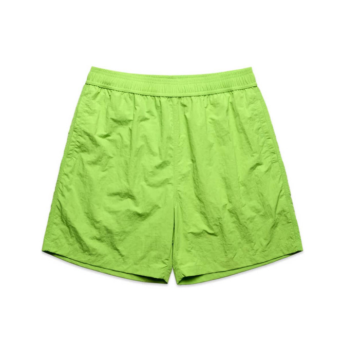 A pair of lime green swim shorts with an elastic waistband and a simple design.