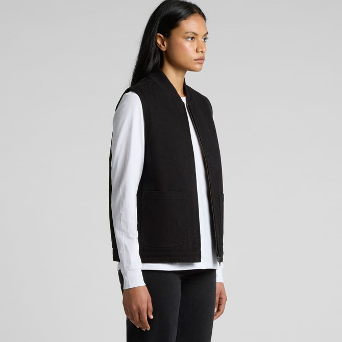 A woman models a black heavy vest with a zip front, featuring two front pockets, against a plain background.