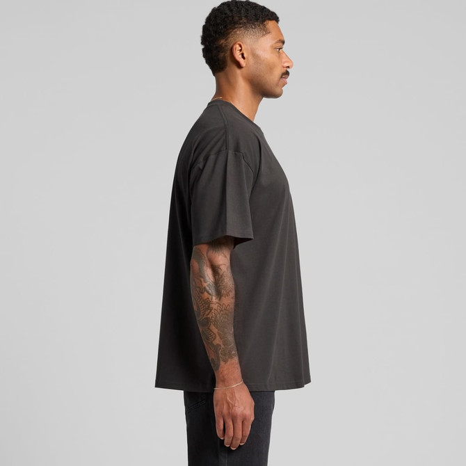 A classic oversized tee in dark colour, featuring short sleeves and a relaxed fit, displayed from the side.
