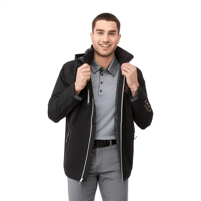 A black men's rain jacket with a logo, worn by a smiling man, featuring a zip-up front and hood.