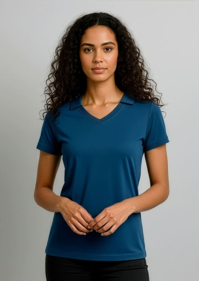 A women's polo shirt in a deep blue colour, featuring short sleeves and a v-neck design, with a logo.