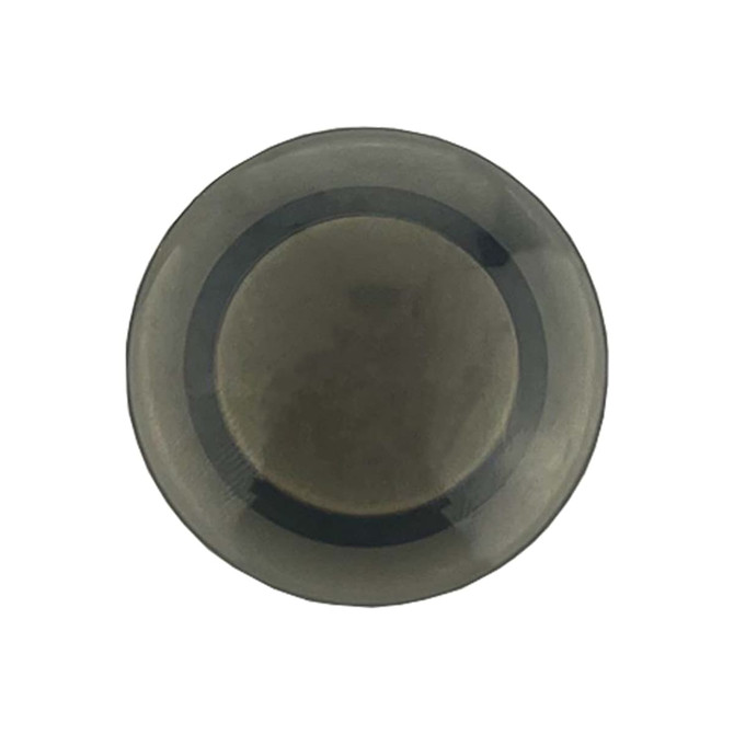 A round plastic button magnet in a dark grey colour, featuring a smooth surface and a central logo.