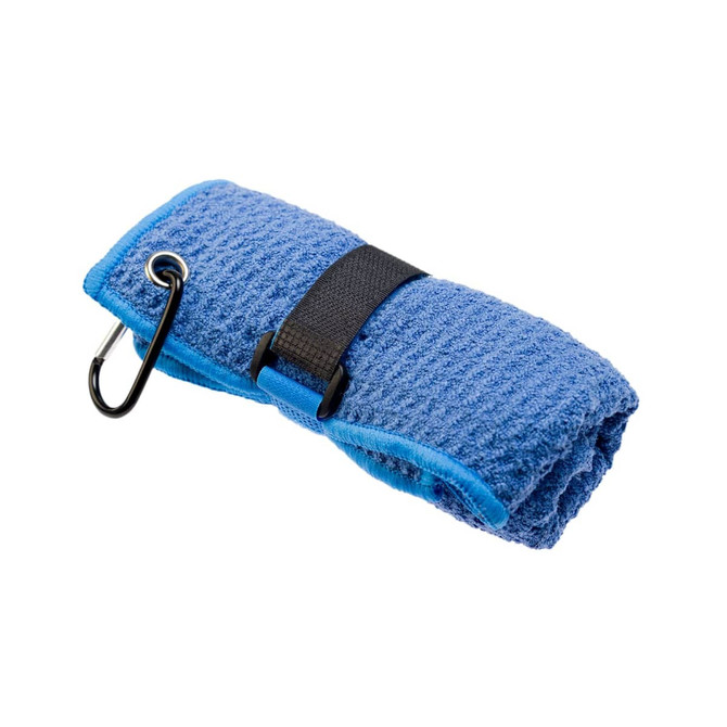A blue travel towel is neatly rolled and secured with a black strap, featuring a carabiner for attachment.
