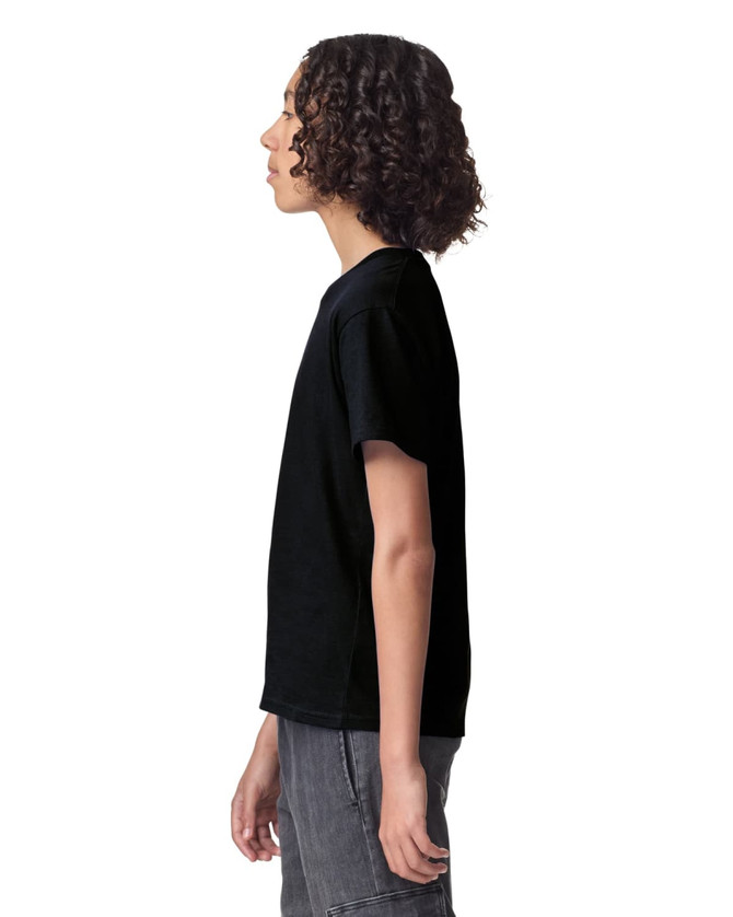 A black youth t-shirt displayed from the side, featuring a simple design and a logo.