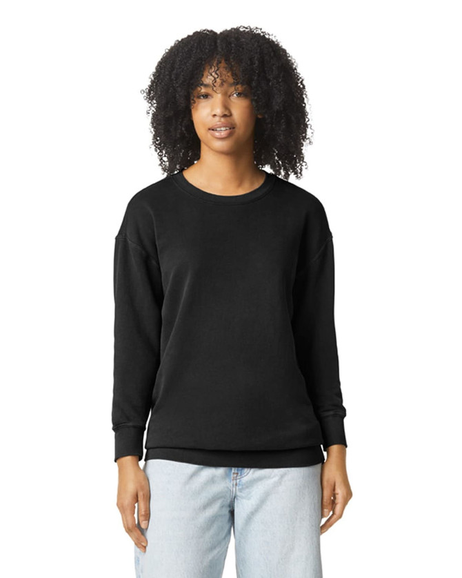 A black lightweight crewneck sweatshirt with long sleeves, featuring a logo, styled on a model.