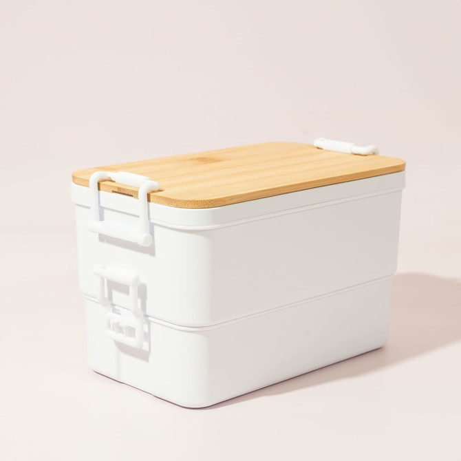 A double stack lunch box in white with a bamboo lid, featuring two compartments and a branded logo.