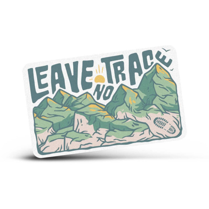 A rectangular sticker featuring green mountains and the phrase "Leave No Trace" in bold lettering.