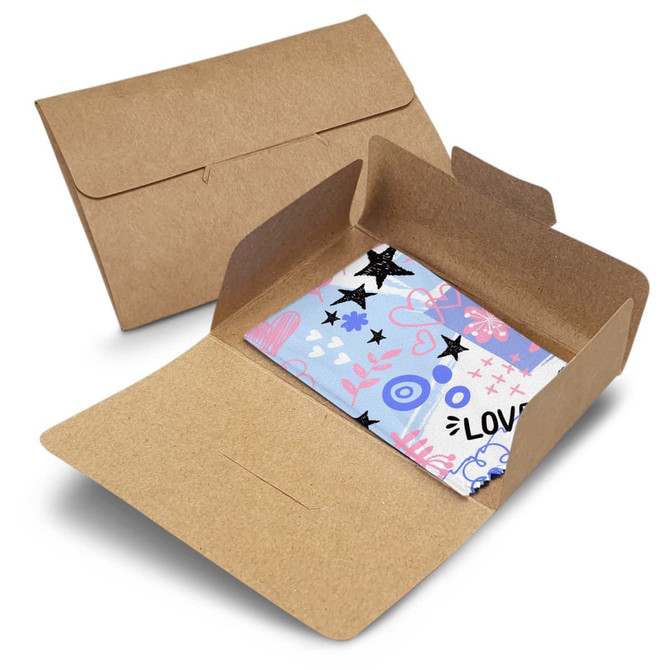A light blue RPET microfibre cleaning cloth featuring a colourful design, presented in a brown kraft envelope.