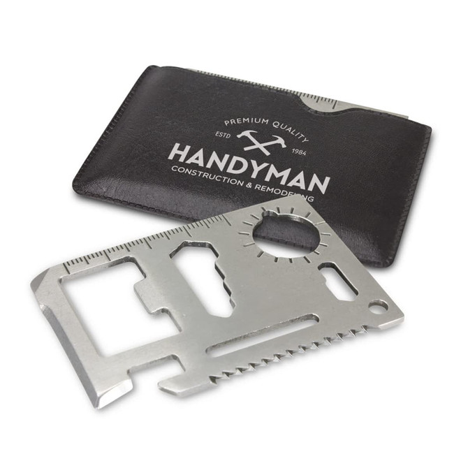 A metallic multi-tool card featuring various tools, placed next to a black cardholder with a logo.