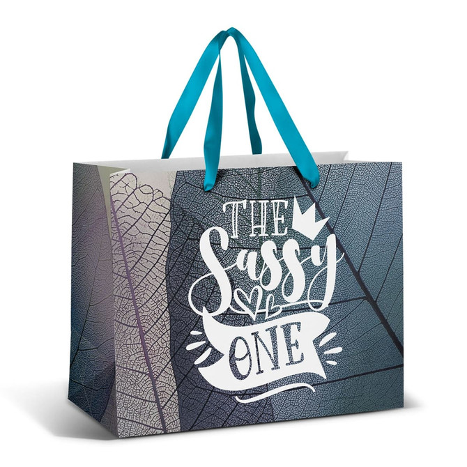 A large paper bag featuring a full colour design with teal ribbon handles and a textured leaf pattern.