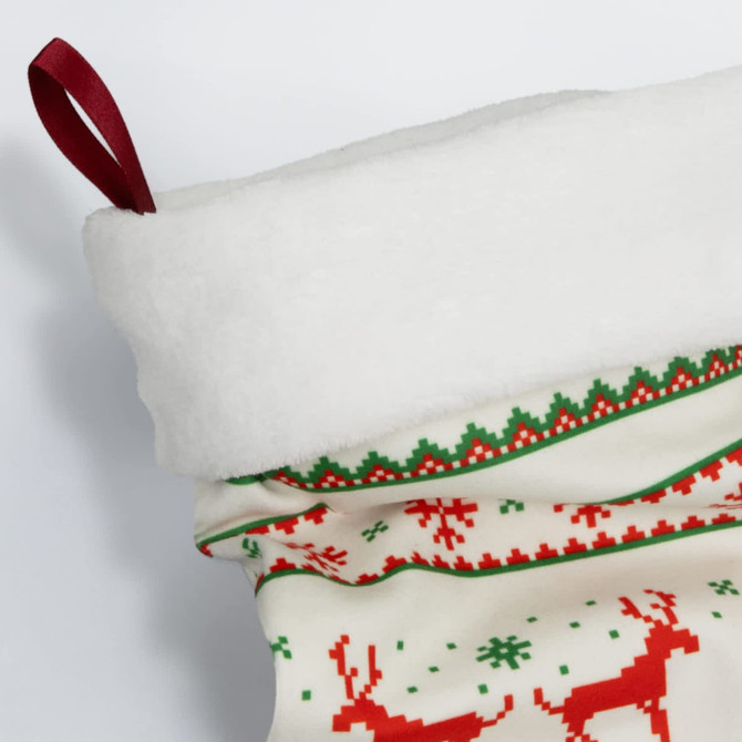 A festive Christmas stocking in white, red, and green, featuring a soft top and decorative patterns.