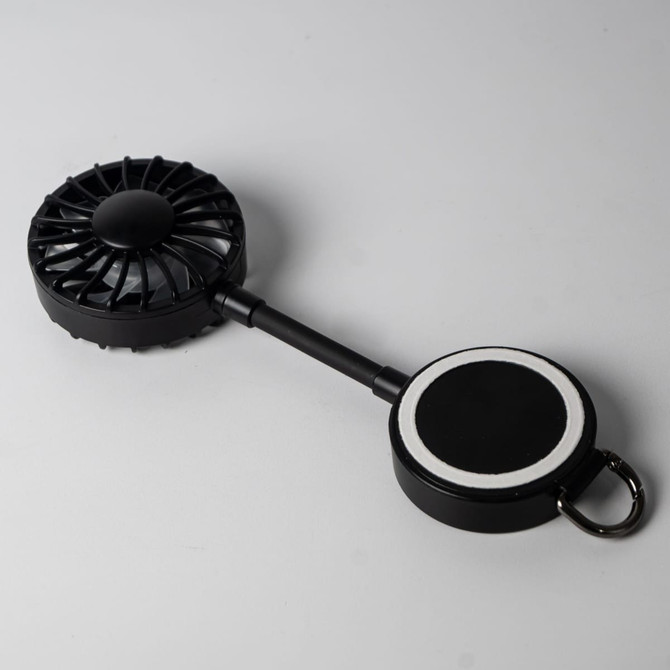 A black magnetic rechargeable fan featuring a Type C charging port, with a circular base for attachment.