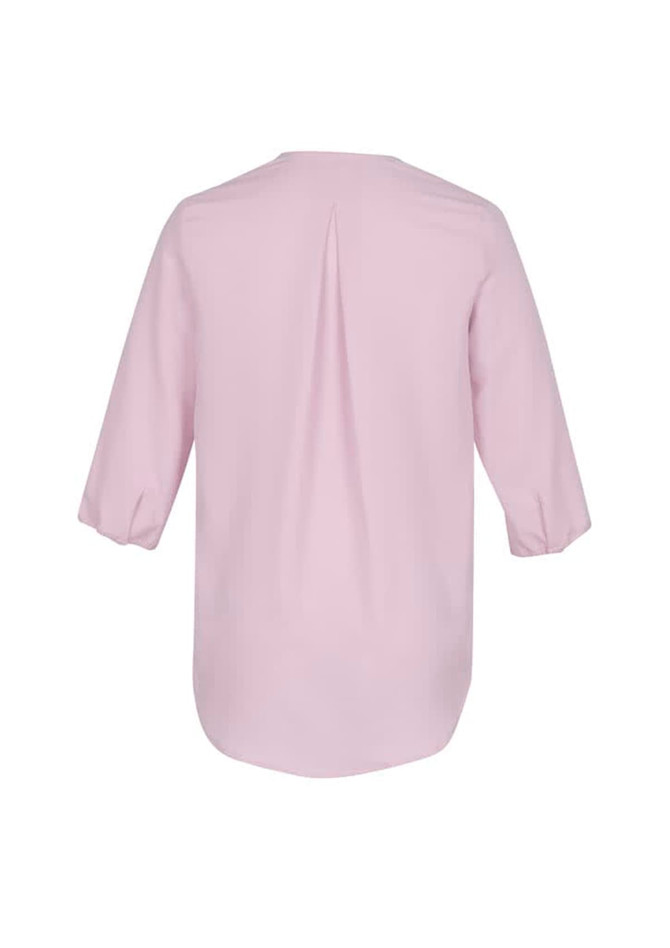 A light pink women's longline blouse with three-quarter sleeves and a central pleat at the back.