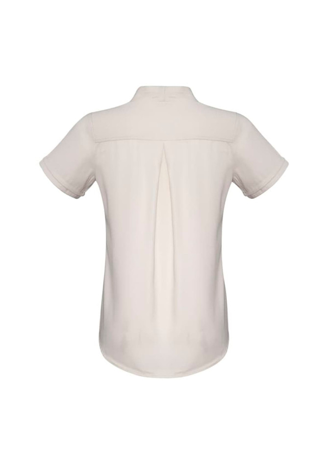 A short sleeve button-up shirt in a cream colour with a back pleat and a logo.