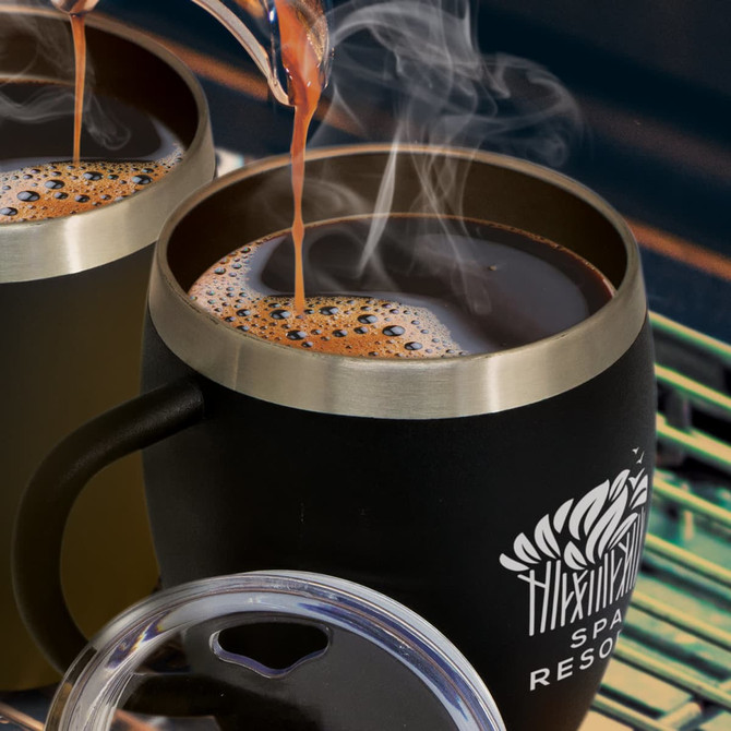 A drink bottle featuring a sleek black exterior and metallic rim, with steaming coffee being poured inside.