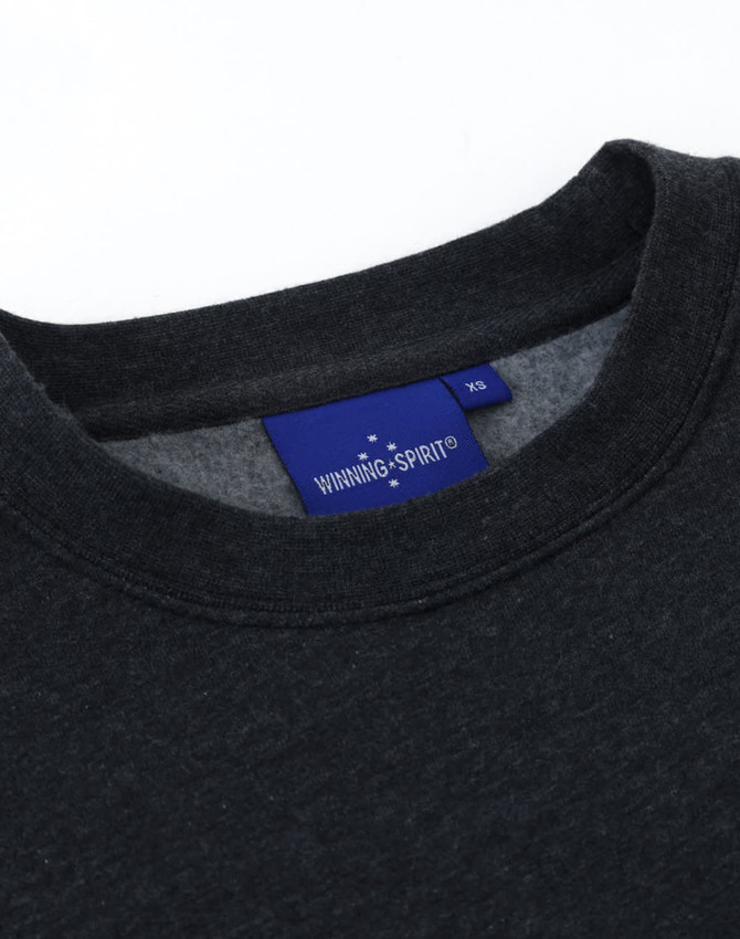 A dark grey crew fleece jumper featuring a round neckline and a branded label inside.