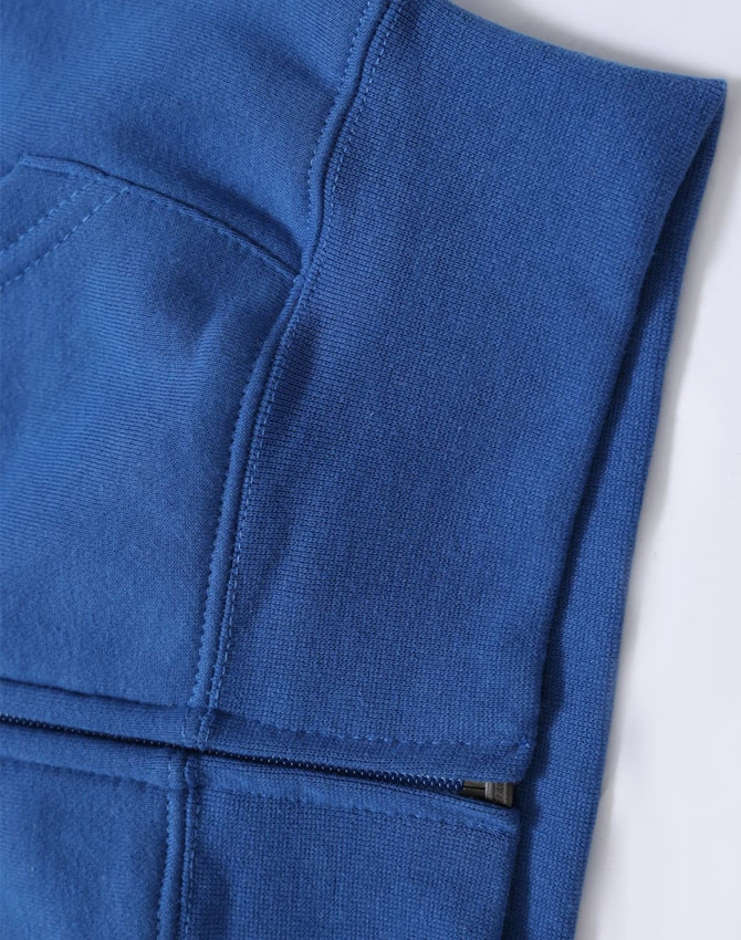A blue full-zip fleecy hoodie with a pocket, featuring a subtle texture and stitching details.