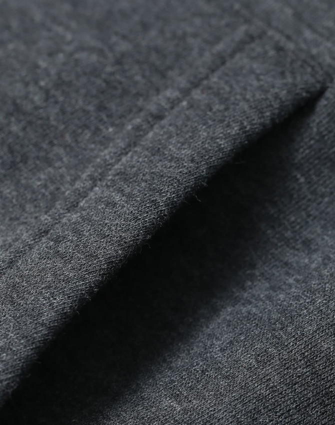 A close-up of a fleecy fabric in dark grey, showcasing the texture of the adult's contrast front hoodie.