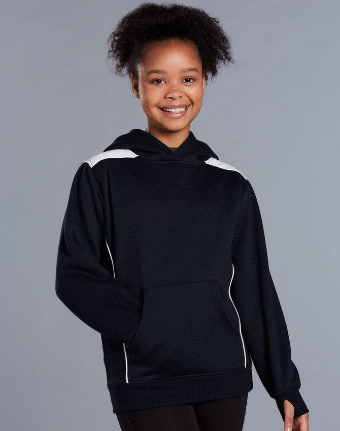 A young girl wearing a navy blue hoodie with white contrast detailing and a kangaroo pocket.