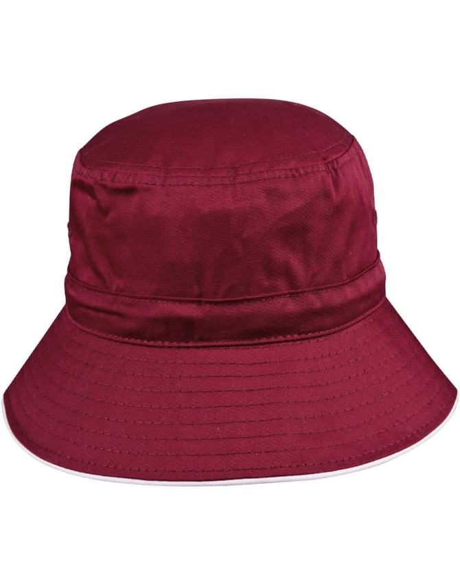 A red bucket hat with a wide brim, featuring a toggle and a logo.