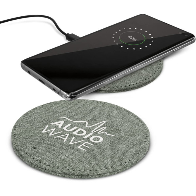 A fabric wireless charger with a green design, featuring a smartphone displaying charging status on top.