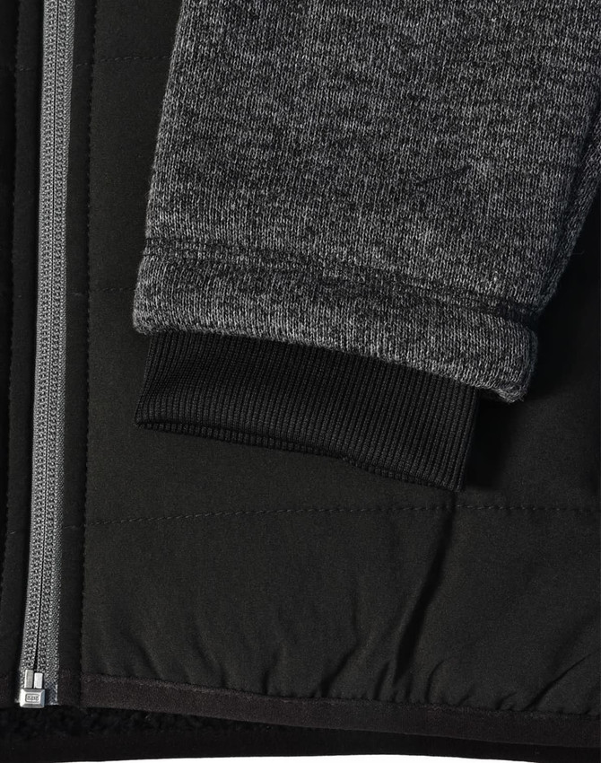 A black quilted jacket featuring heather grey sleeves and a ribbed cuff, with a side zipper and fabric texture detail.