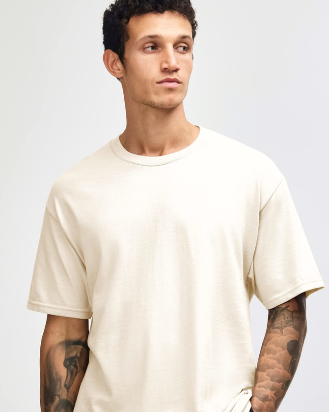 A heavyweight cotton unisex T-shirt in cream, featuring a simple design and a slight stretch fit.