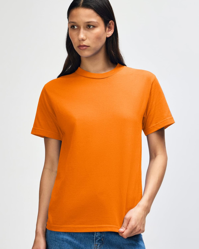 An orange heavyweight cotton unisex T-shirt displayed on a model with a neutral background.