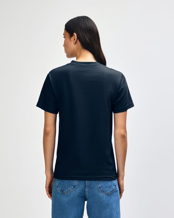 A black heavyweight cotton unisex T-shirt viewed from the back, worn with blue jeans. The shirt features a logo.