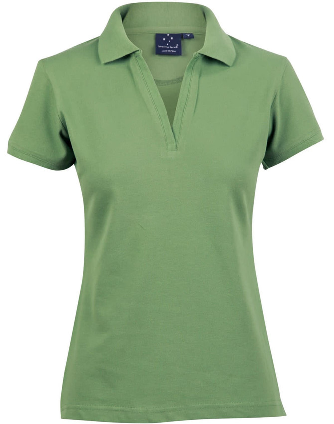 A green ladies’ polo shirt with a collar and a logo on the upper left side.