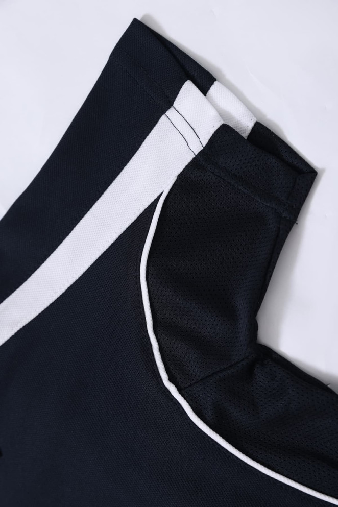 A navy and white kids' polo shirt with a collar and neatly stitched details. The fabric appears lightweight and breathable.