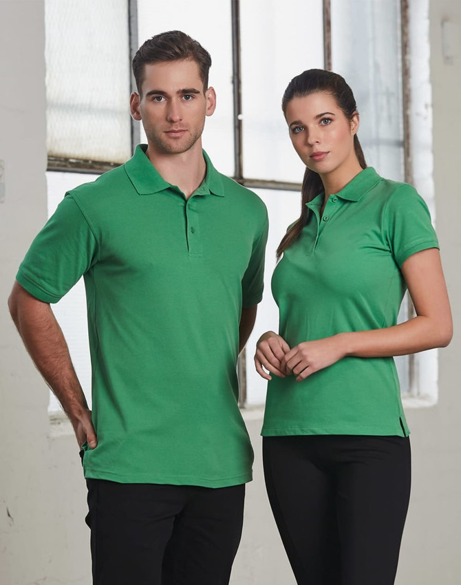 A green men's polo shirt paired with a matching green polo shirt for women, both featuring a logo.