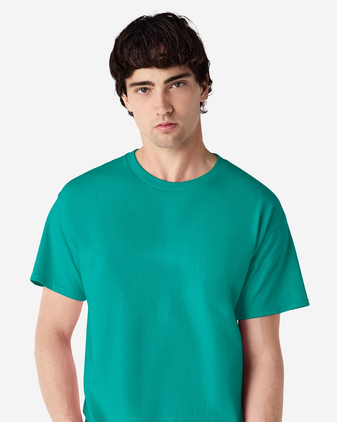 A turquoise adult t-shirt displayed on a model, featuring a classic crew neck and short sleeves.
