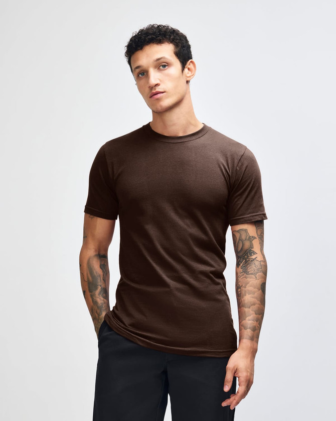 A unisex fine jersey short sleeve t-shirt in brown, featuring a simple design and a logo on the garment.