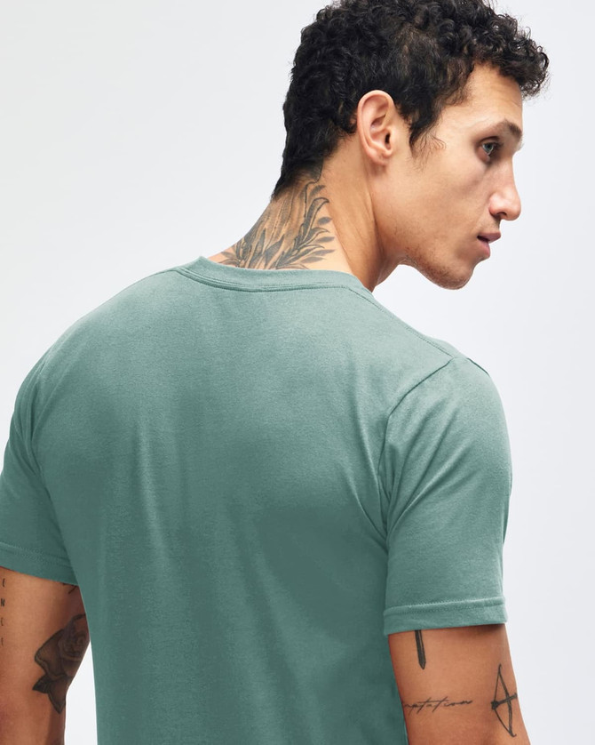 A green short sleeve T-shirt featuring a fitted design and a logo on the back.