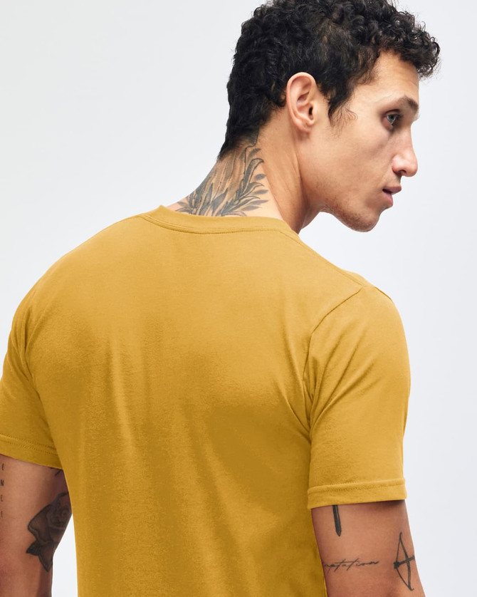 A mustard yellow short sleeve t-shirt featuring a crew neck and a subtle logo on the back.
