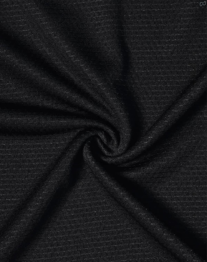 A close-up of black bamboo charcoal fabric with a textured weave, showcasing its soft and breathable quality.